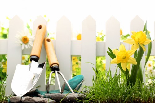 Gardener preparing tools on a neat lawn for garden service